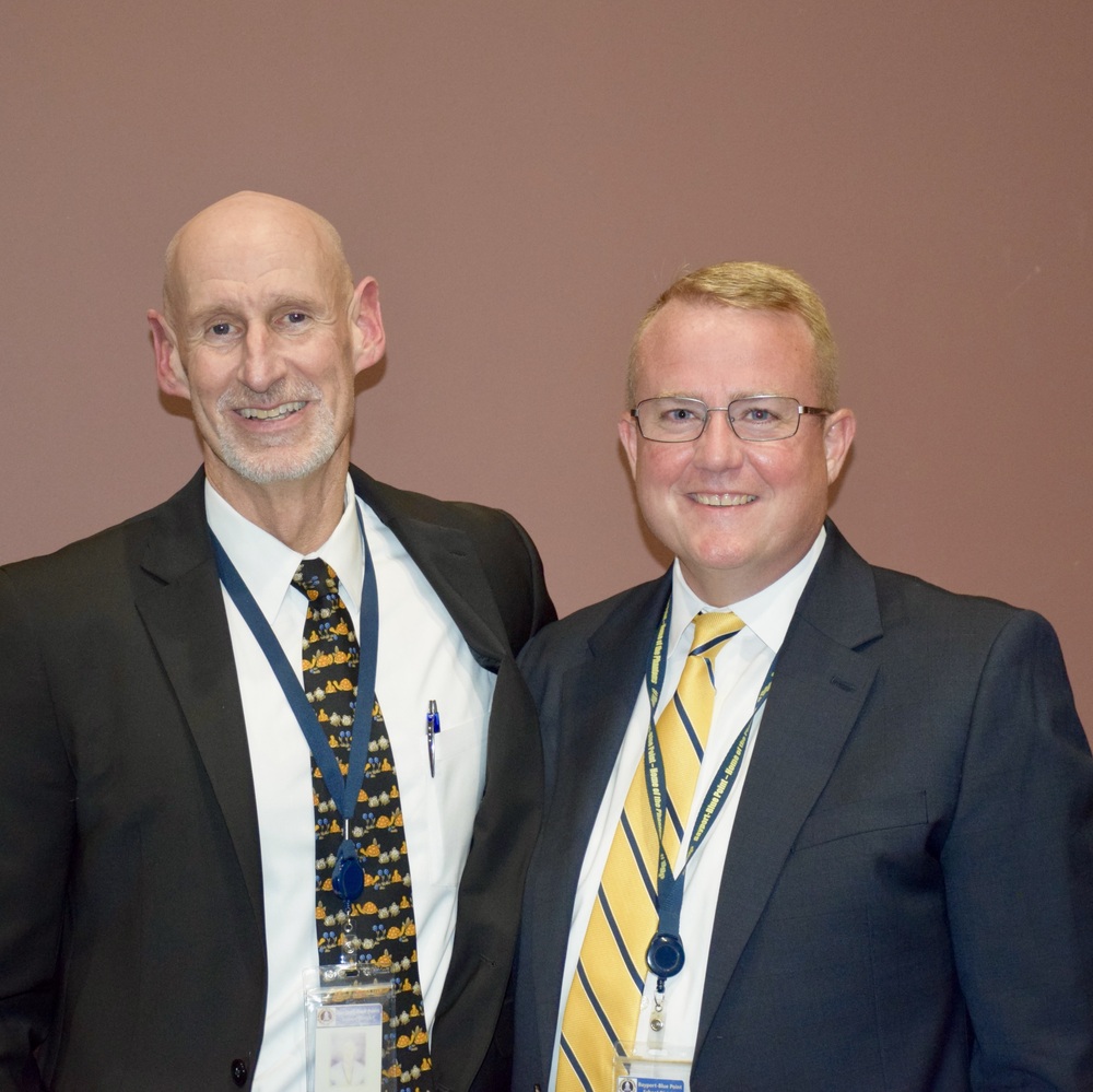 Board of education members smiling together.