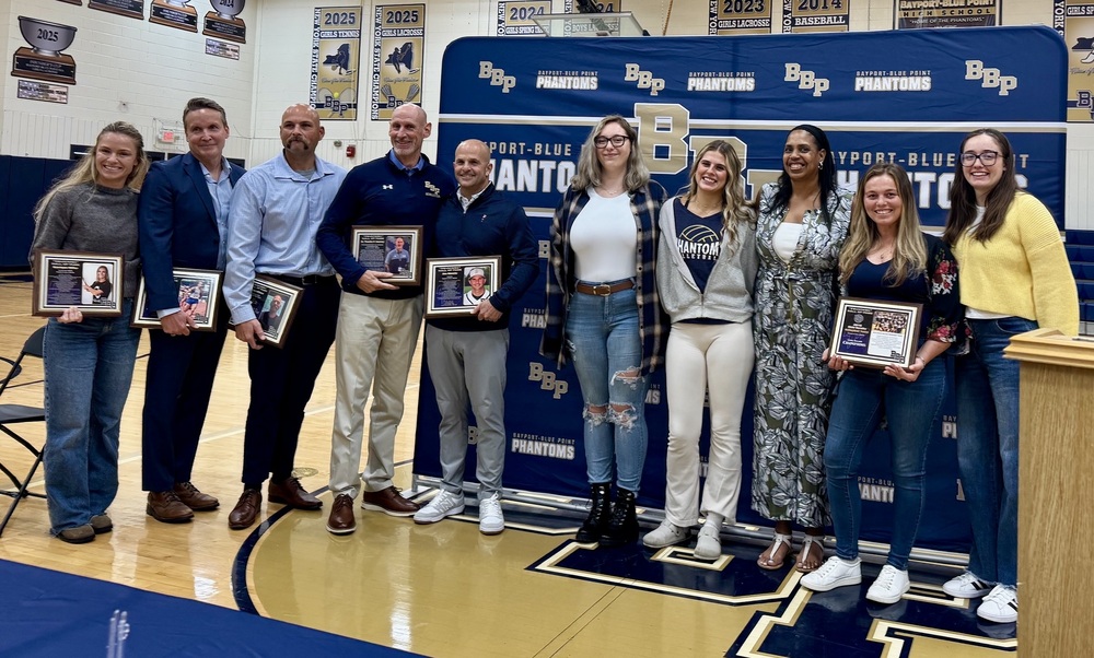 Group holding awards at event