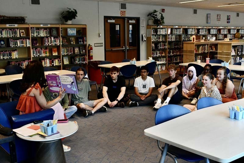 Seniors in Mrs. Pintar’s AP Literature class took a trip down memory lane during one of their final days together, gathering in the library for a special read-aloud reminiscent of their elementary school years.