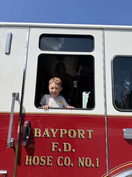Student inside fire truck.