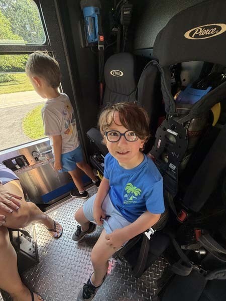Student inside fire truck.