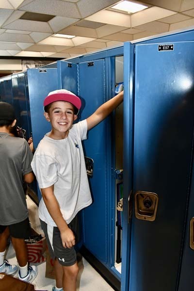 Students opening their lockers.