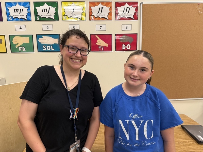 Two people in classroom setting