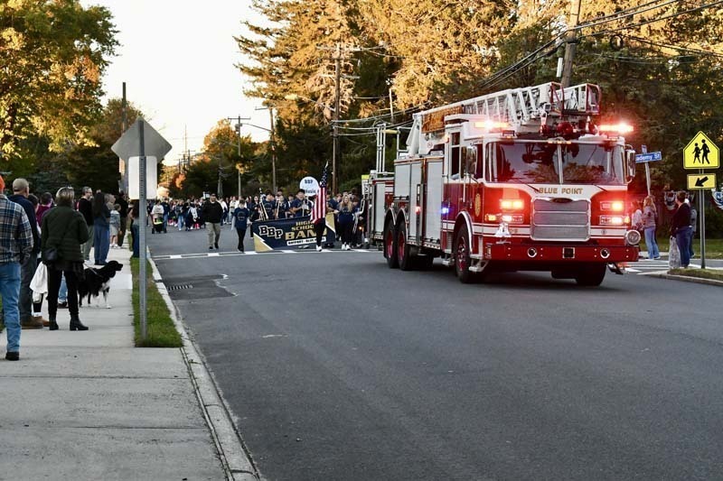 Firetruck driving during parade.