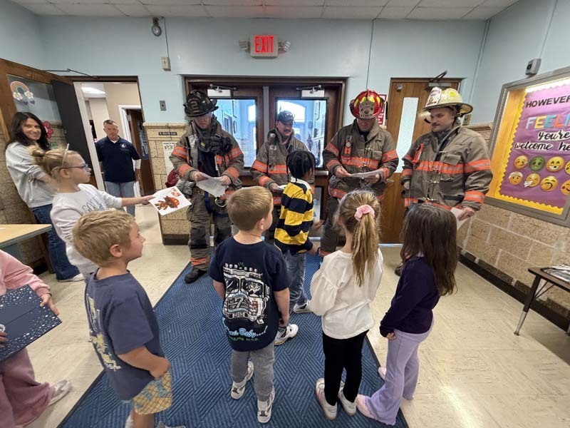 Students listening to Police and Fire Department representatives.