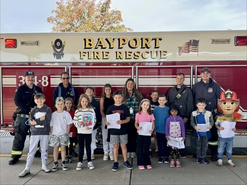 Students listening to Police and Fire Department representatives.