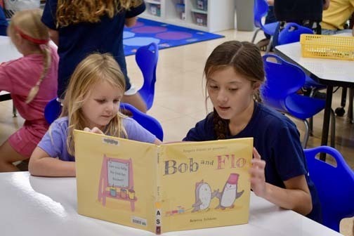 Students reading together.