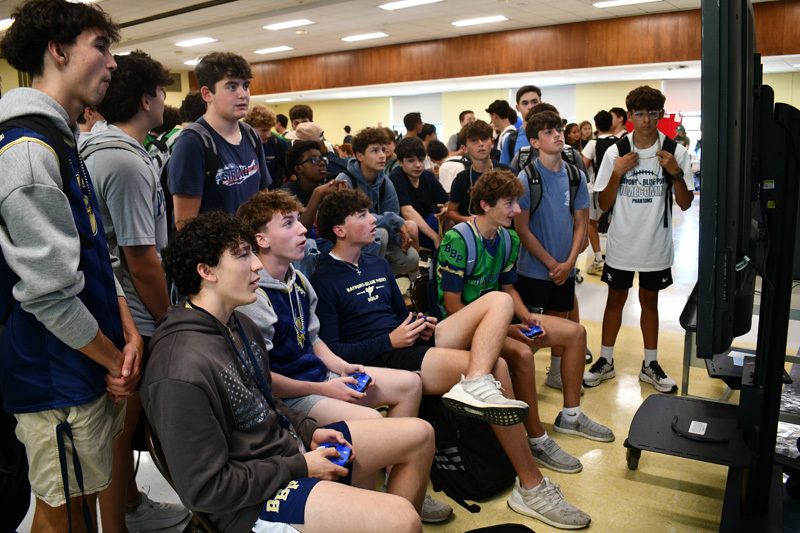 students watching the television up front