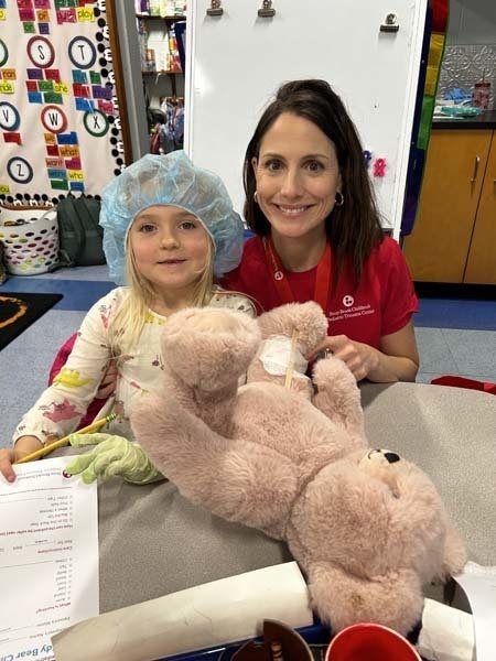 Students holding their Teddy Bears.
