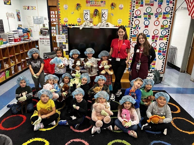 Students holding their Teddy Bears.