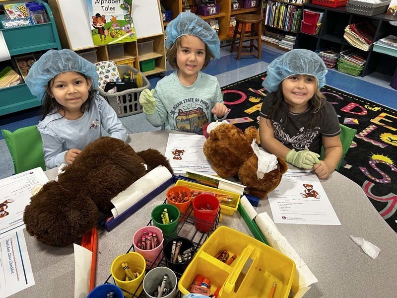 Students holding their Teddy Bears.