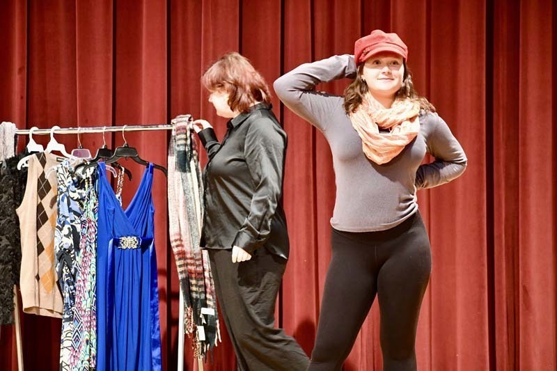 Students performing play on stage.