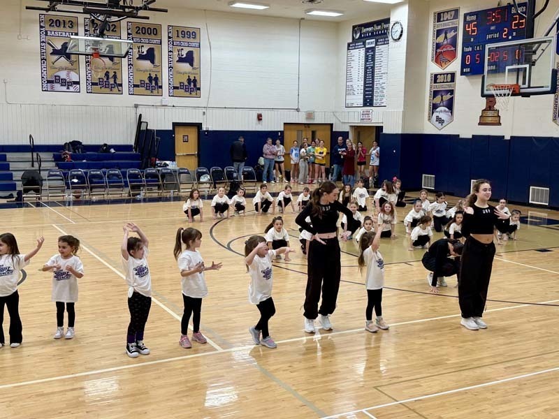 Students dancing in gymnasium.