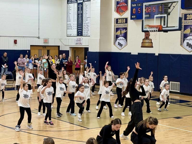 Students dancing in gymnasium.