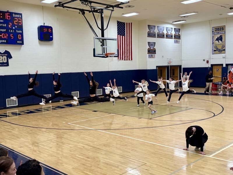 Students dancing in gymnasium.
