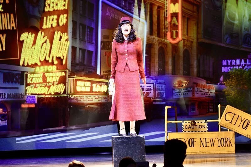 Students on stage in costume.