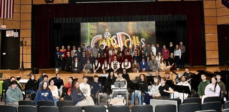 Students on stage in costume.