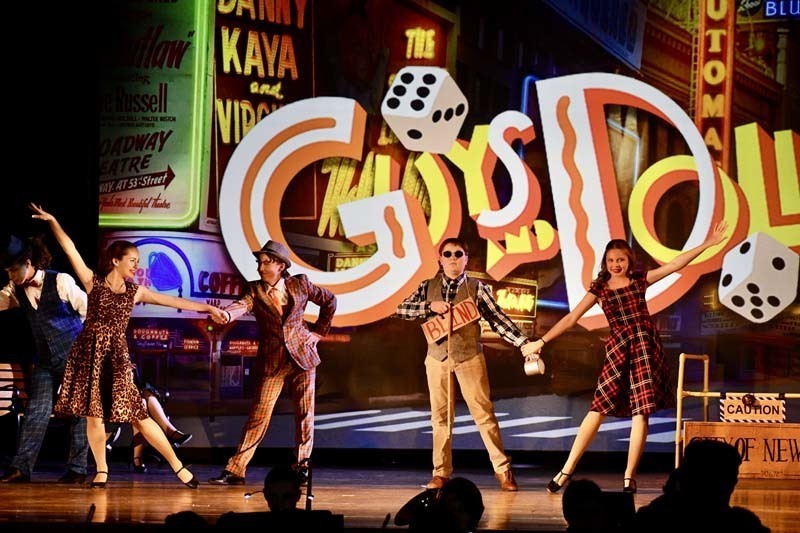 Students on stage in costume.