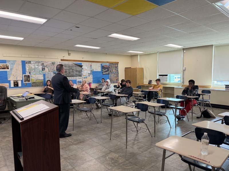 Man giving presentation to students.