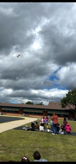 Kindergarten students watching the air show