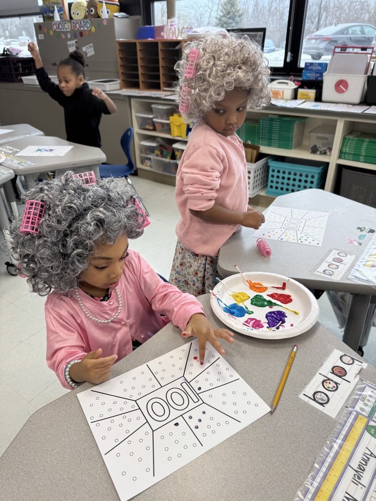 100 year olds painting together 