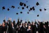 Graduates throwing hats up in the air 