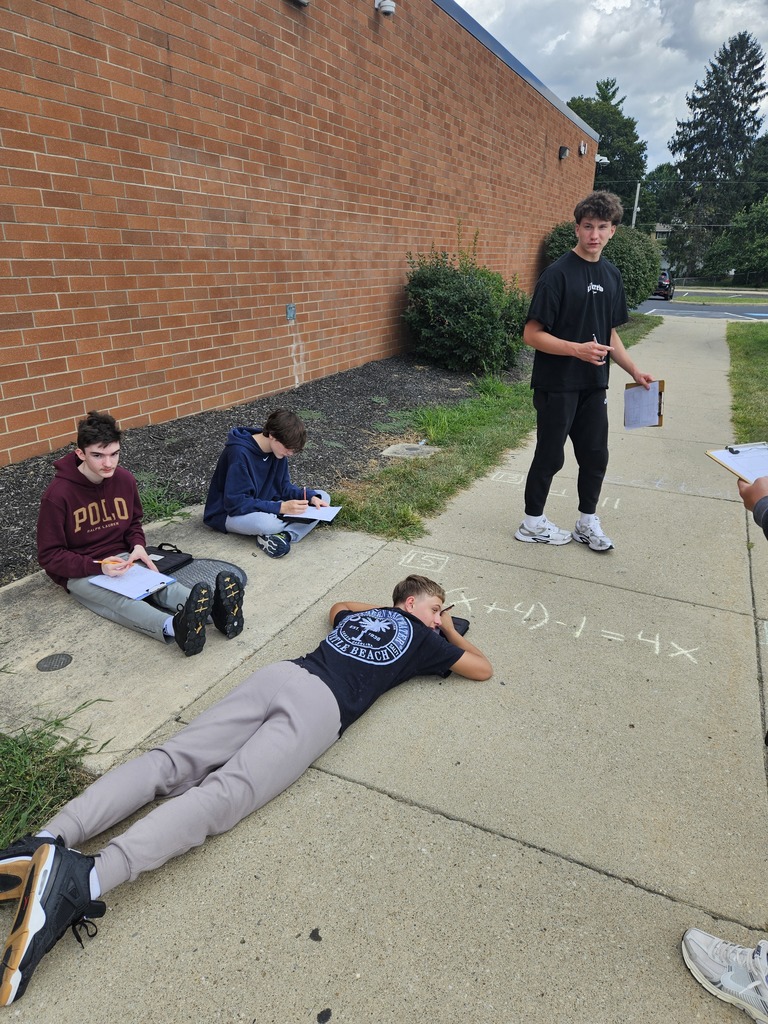 Students learning outside at Ferguson Hall