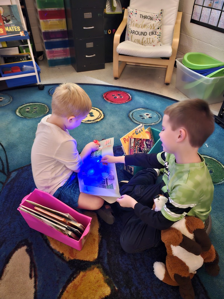 Students reading books for flashlight Friday