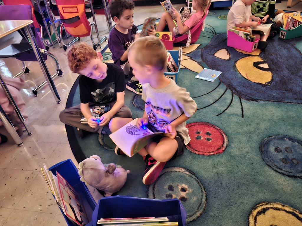 Students reading books for flashlight Friday
