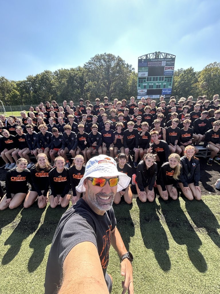 boys and girls jv cross country teams selfie with coach russ