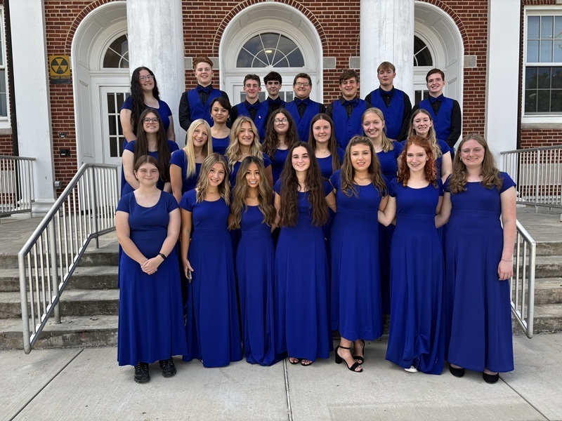 Varsity Singers in front of High School