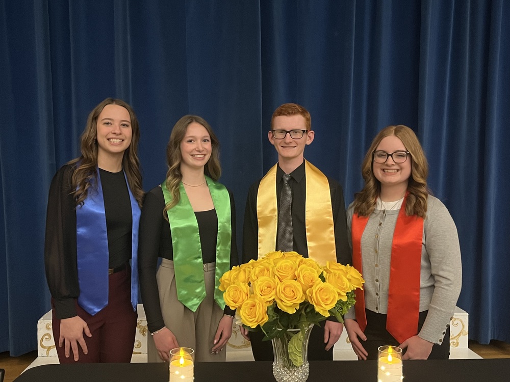 The 2025-2026 National Honor Society officer team of Addison Clark (President), Alexis Hershey (Vice President), Zane Ednie (Secretary), and Ellie Rose (Treasurer). 