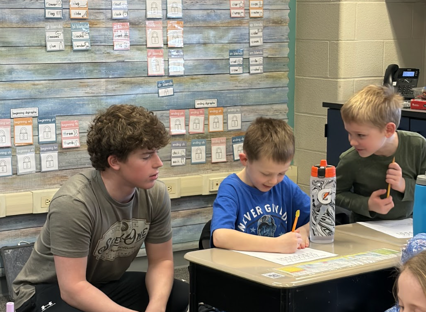 Gabe Taylor working with elementary kids