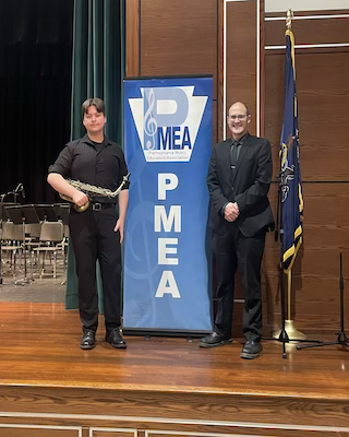 Peyton Crosten beside Mr. Lybarger