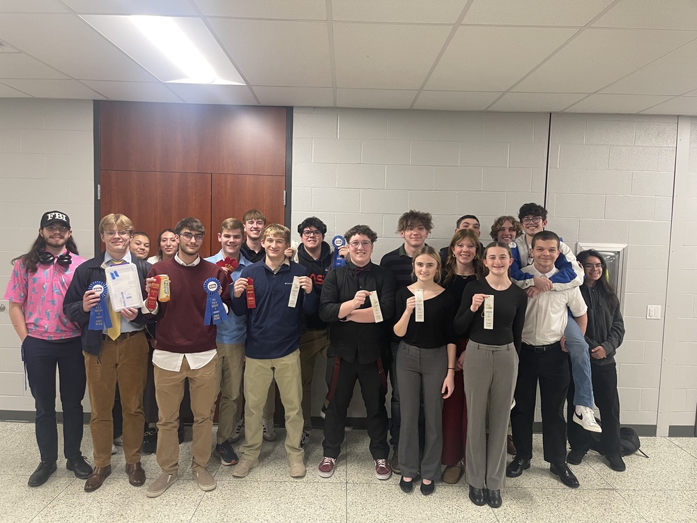 TSA students holding their awards