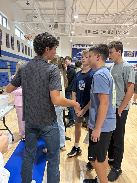 Photo 1: Students talking at the fair