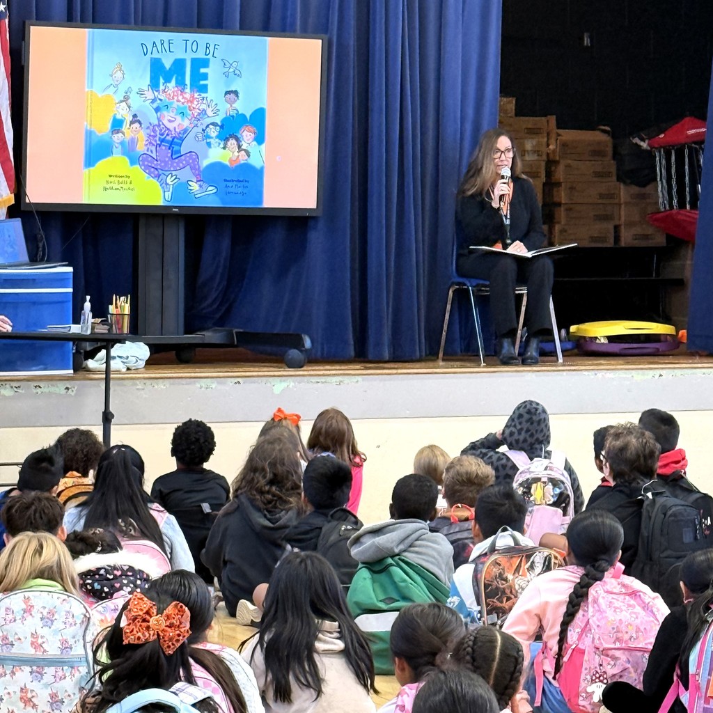 Dr. Garrett at Eakin Elementary for Friendship Day reading a book