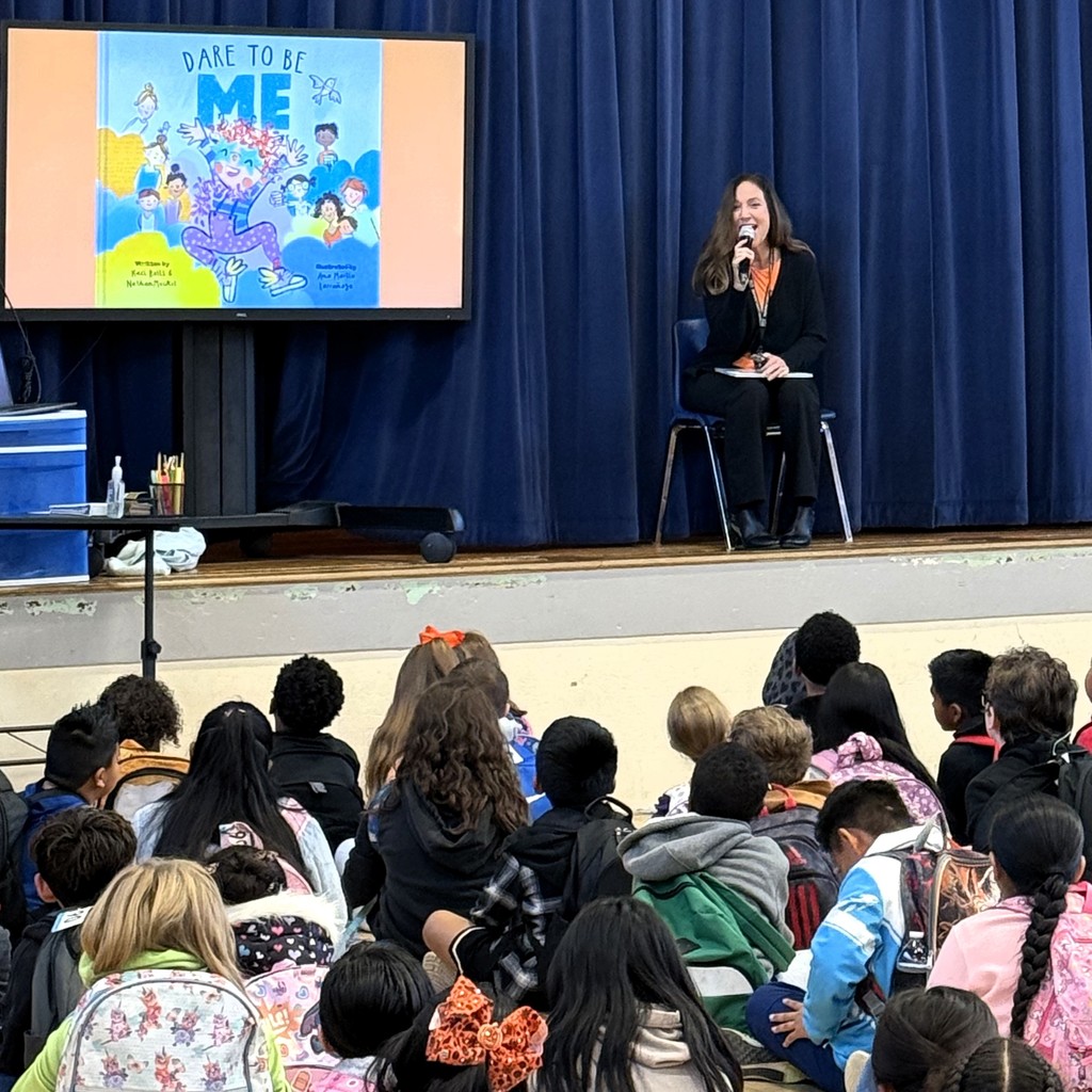 Dr. Garrett at Eakin Elementary for Friendship Day reading a book