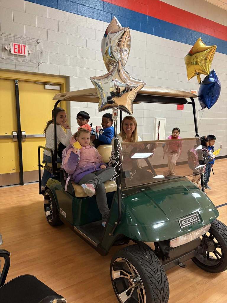 principals list riding a golf cart