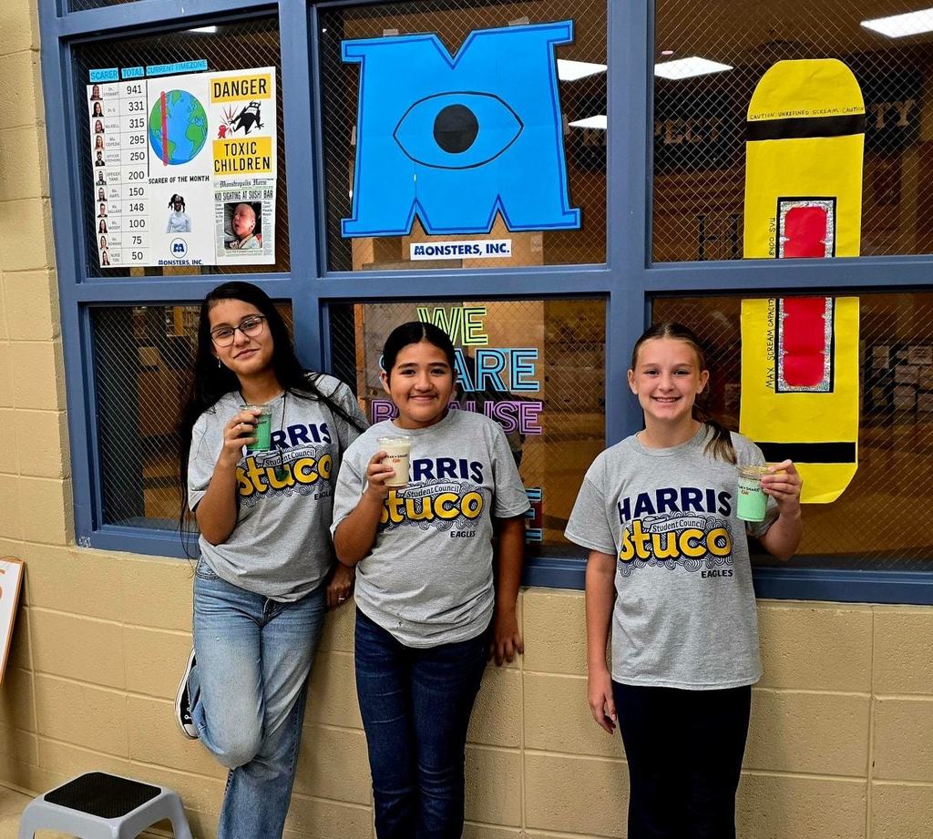 Students showing off some of the milkshakes that were doanted for Parent Teacher Conferences