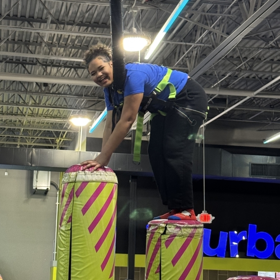 student enjoying time on Urban Air Field Trip.