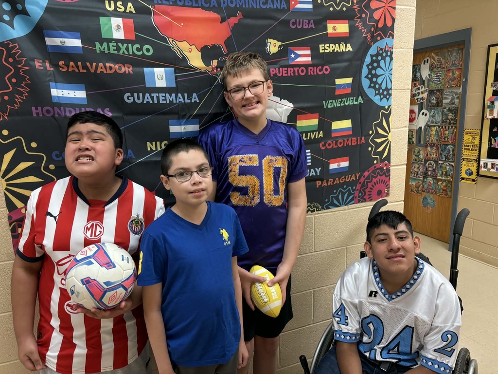 Students showing pride in their artwork