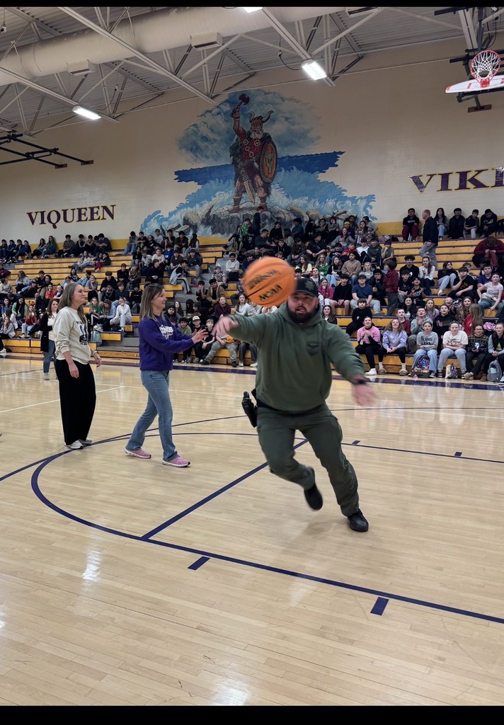 adults playing basketball