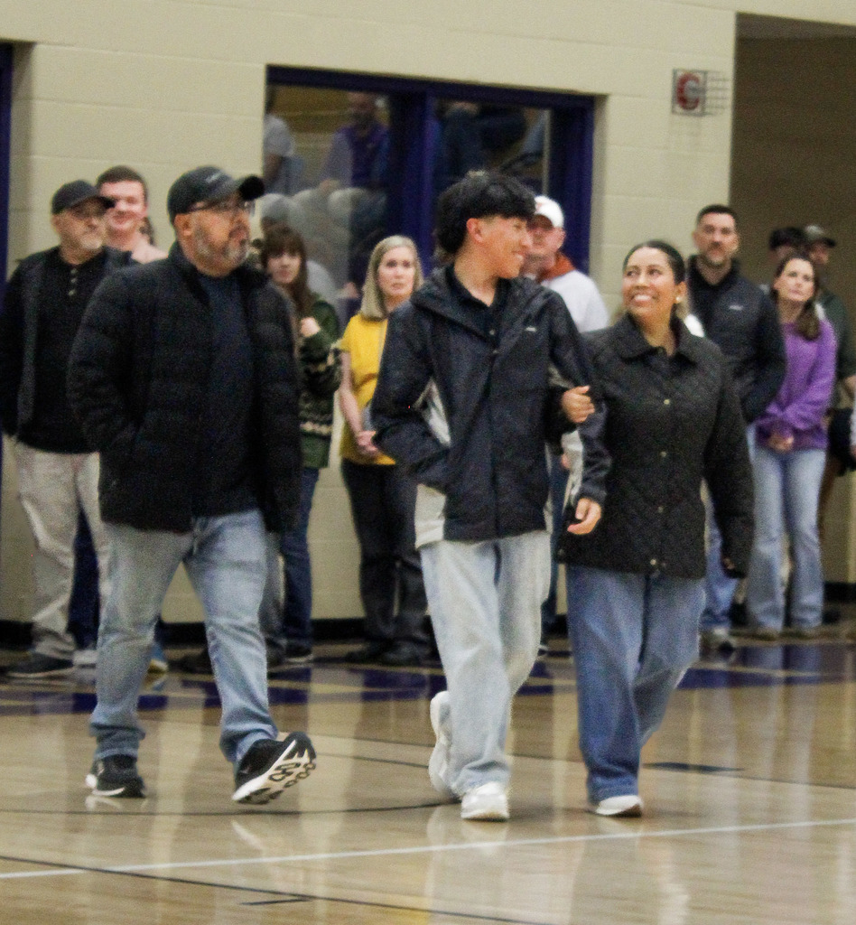 Seniors who were recently recognized at a basketball game for scoring 21 or higher on the ACT last year