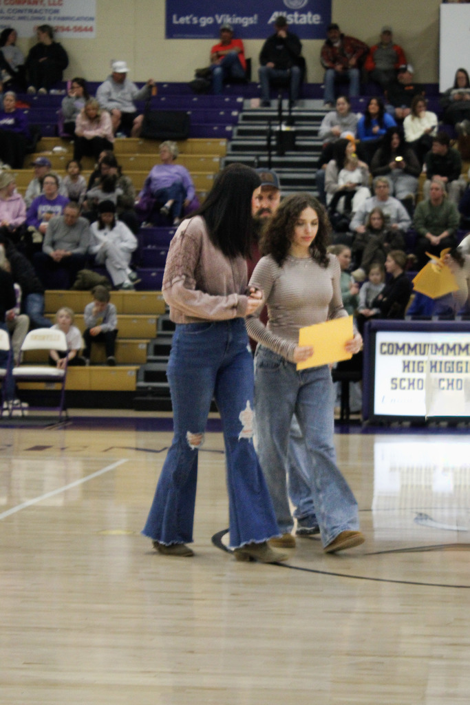 Seniors who were recently recognized at a basketball game for scoring 21 or higher on the ACT last year