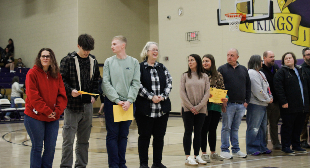 Seniors who were recently recognized at a basketball game for scoring 21 or higher on the ACT last year