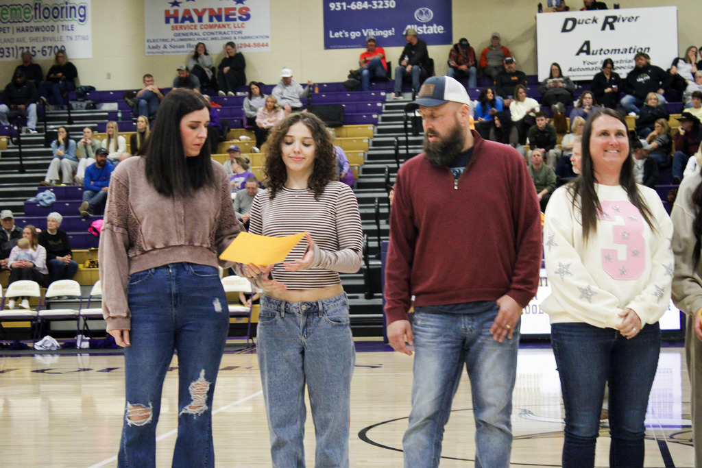 Seniors who were recently recognized at a basketball game for scoring 21 or higher on the ACT last year