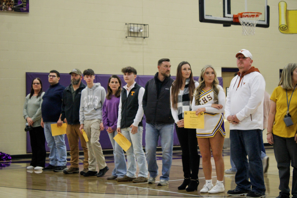 Seniors who were recently recognized at a basketball game for scoring 21 or higher on the ACT last year