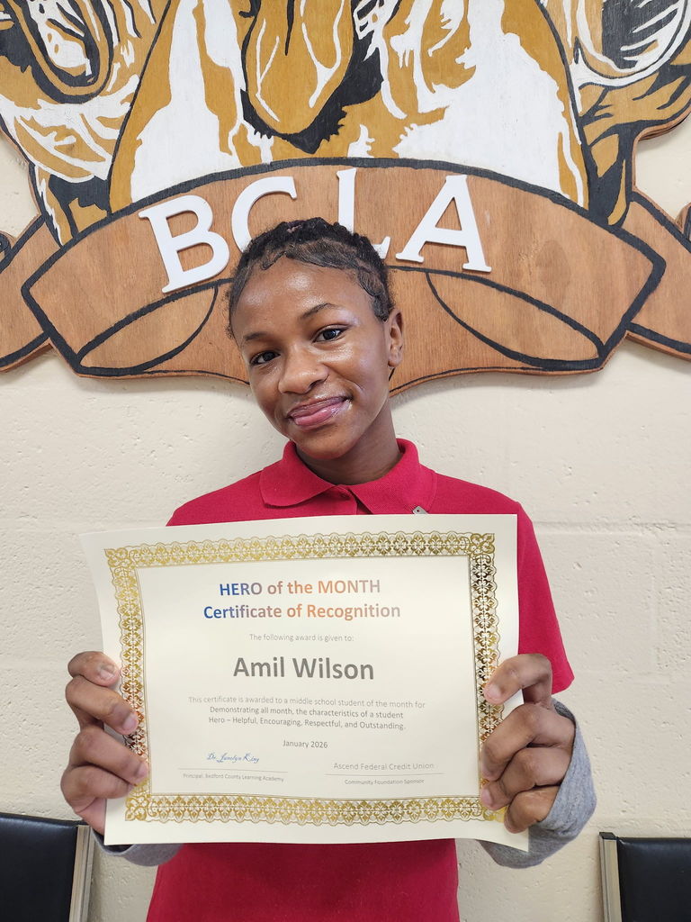 Amil receiving her HERO of the month award