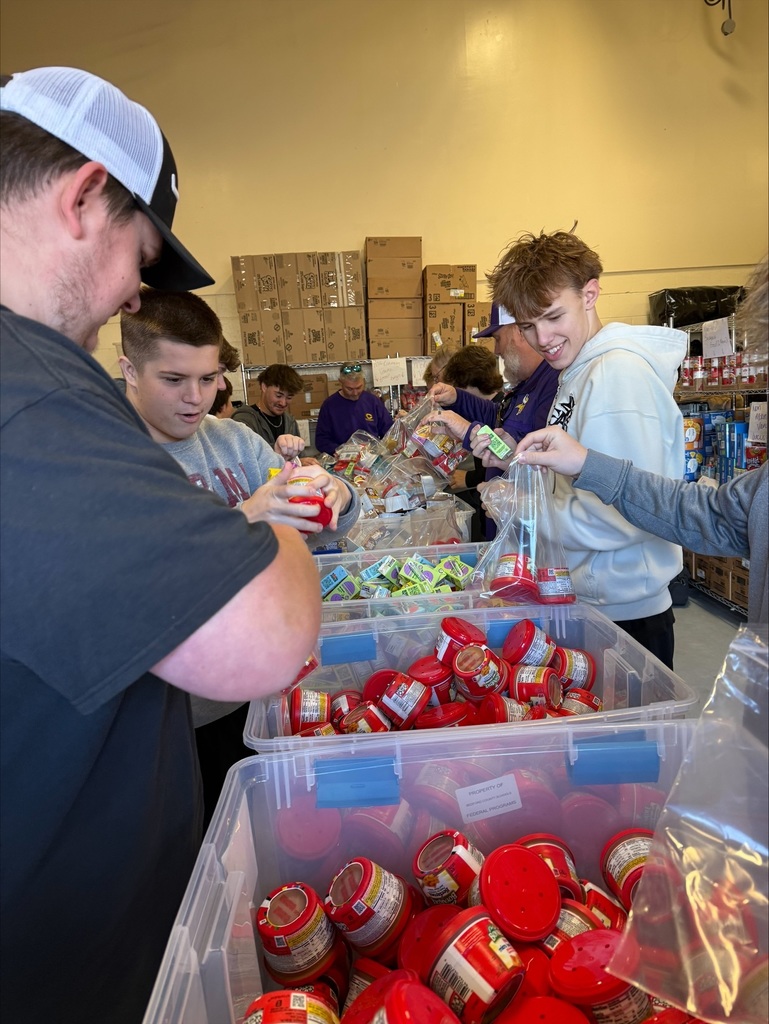 Community High School Football Team Volunteers to Pack Food for Backpack Program